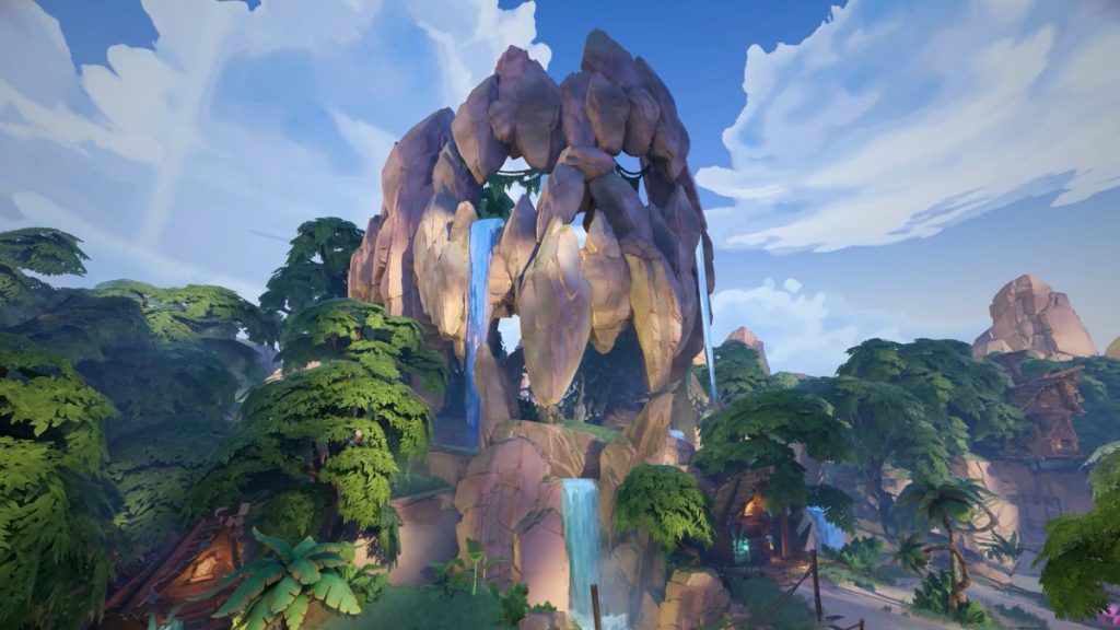 Un paysage naturel avec une structure rocheuse majestueuse au milieu d'une végétation verdoyante et luxuriante, comprenant des arbres et des habitations rustiques, sous un ciel clair avec quelques nuages.