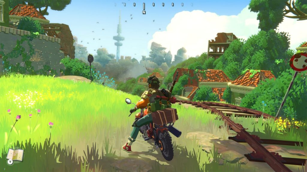 Un personnage à moto avance à travers une vallée verdoyante, entouré de ruines d'une civilisation disparue et d'une végétation luxuriante, avec un ciel bleu lumineux en arrière-plan.