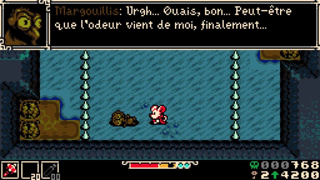Personnage de jeu vidéo marchant près d'un tas de déchets dans un environnement aquatique, avec un dialogue en haut de l'image.